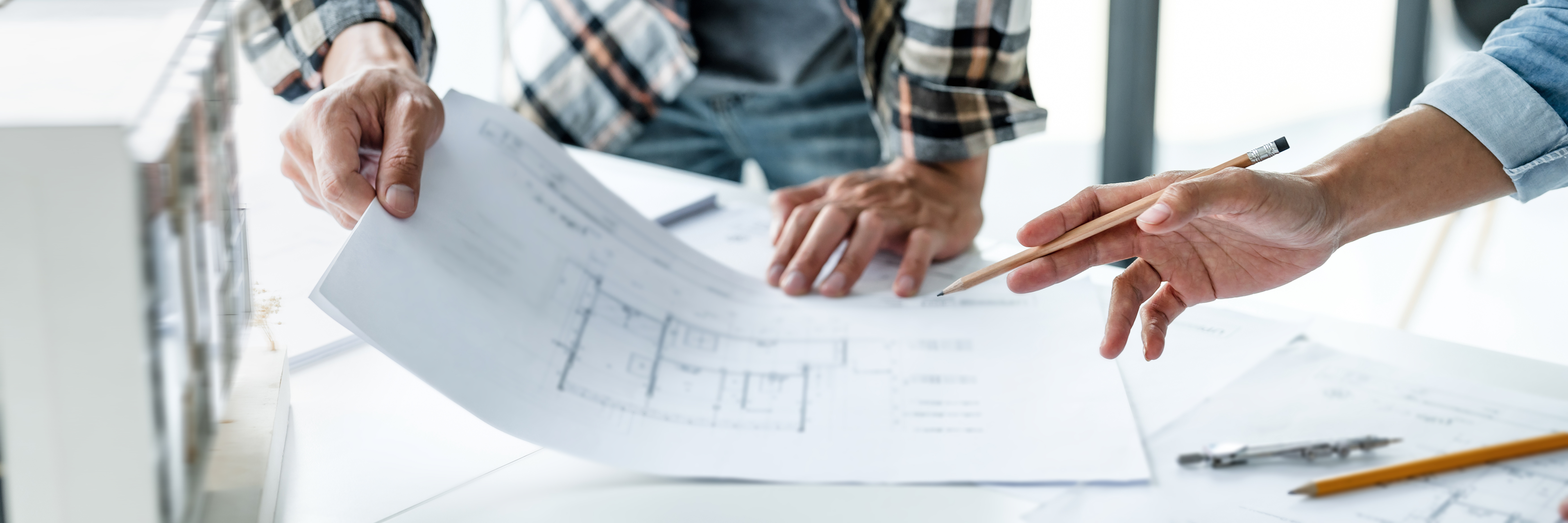 Engineers reviewing technical drawings for accurate documentation, supporting product development and installation instructions at RFA Engineering.