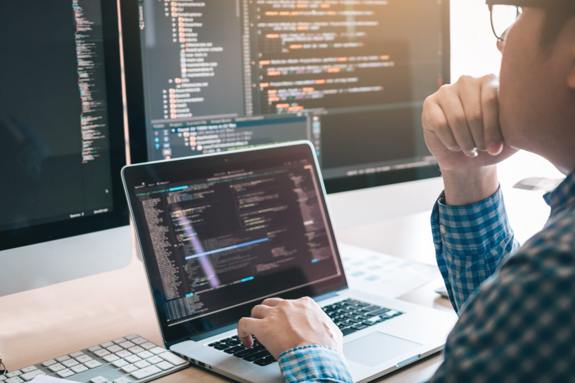 Software engineer from RFA working at his desk